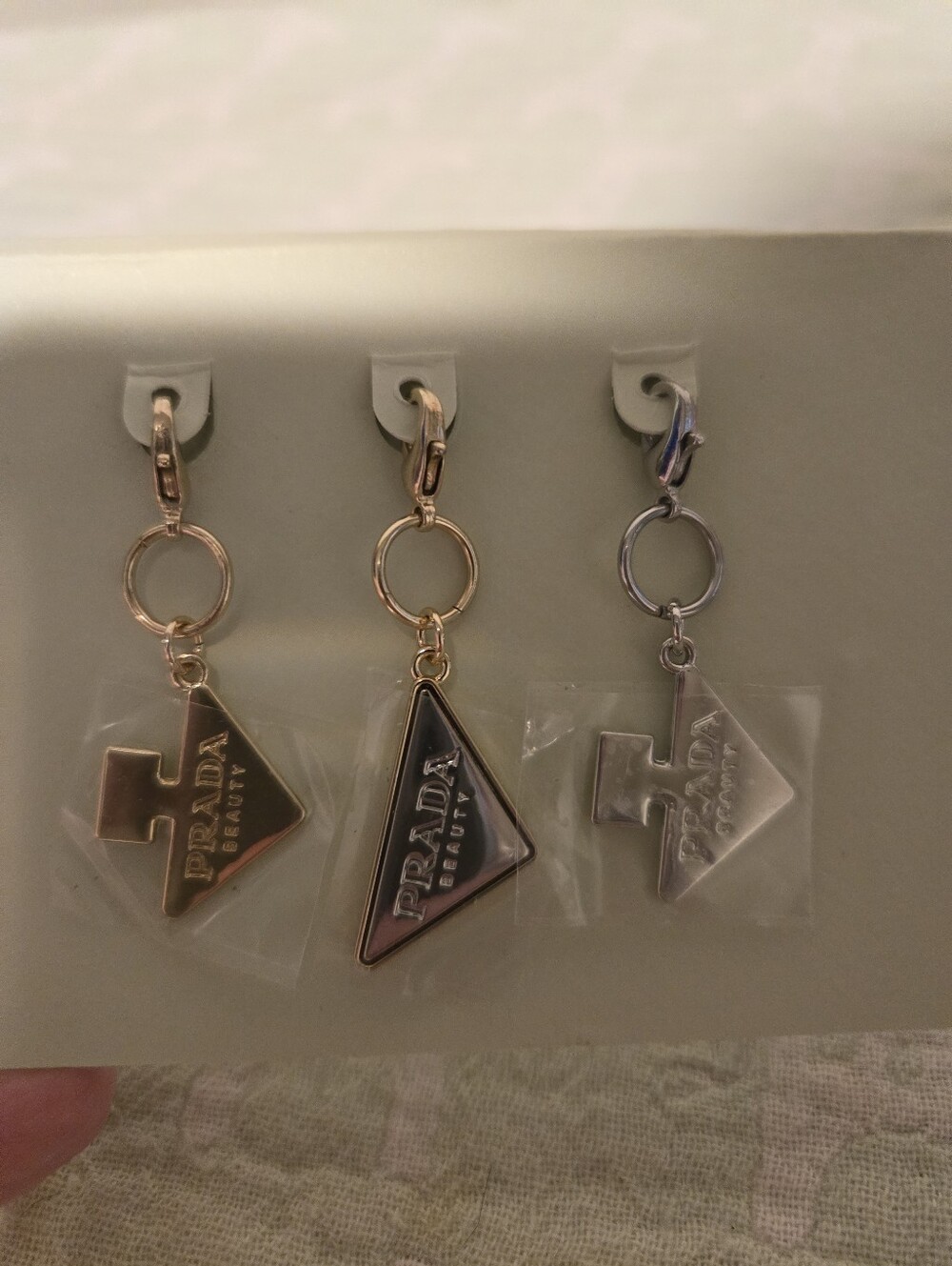 Prada Beauty Triangle Logo Small Charms Set Of 3.